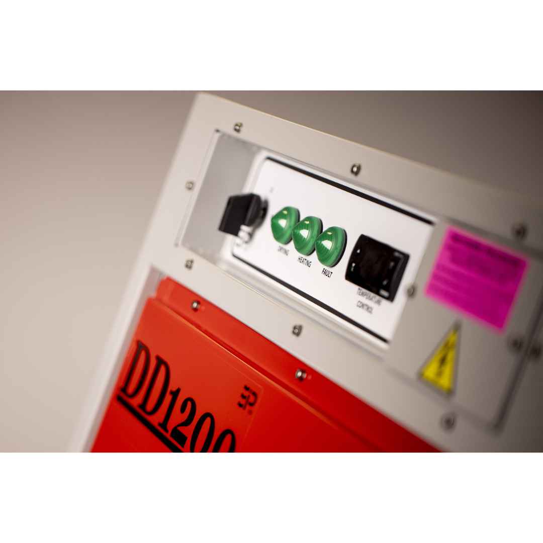 Control panel close-up of Ebac DD1200 Desiccant Dehumidifier displaying electronic indicators and adjustable system controls for industrial drying operations