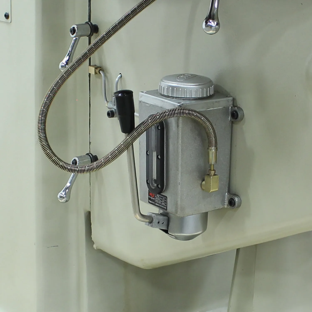Coolant and lubrication system access on the Baileigh Vertical Knee Mill - VM-942E-1 1020695 for efficient machine maintenance.