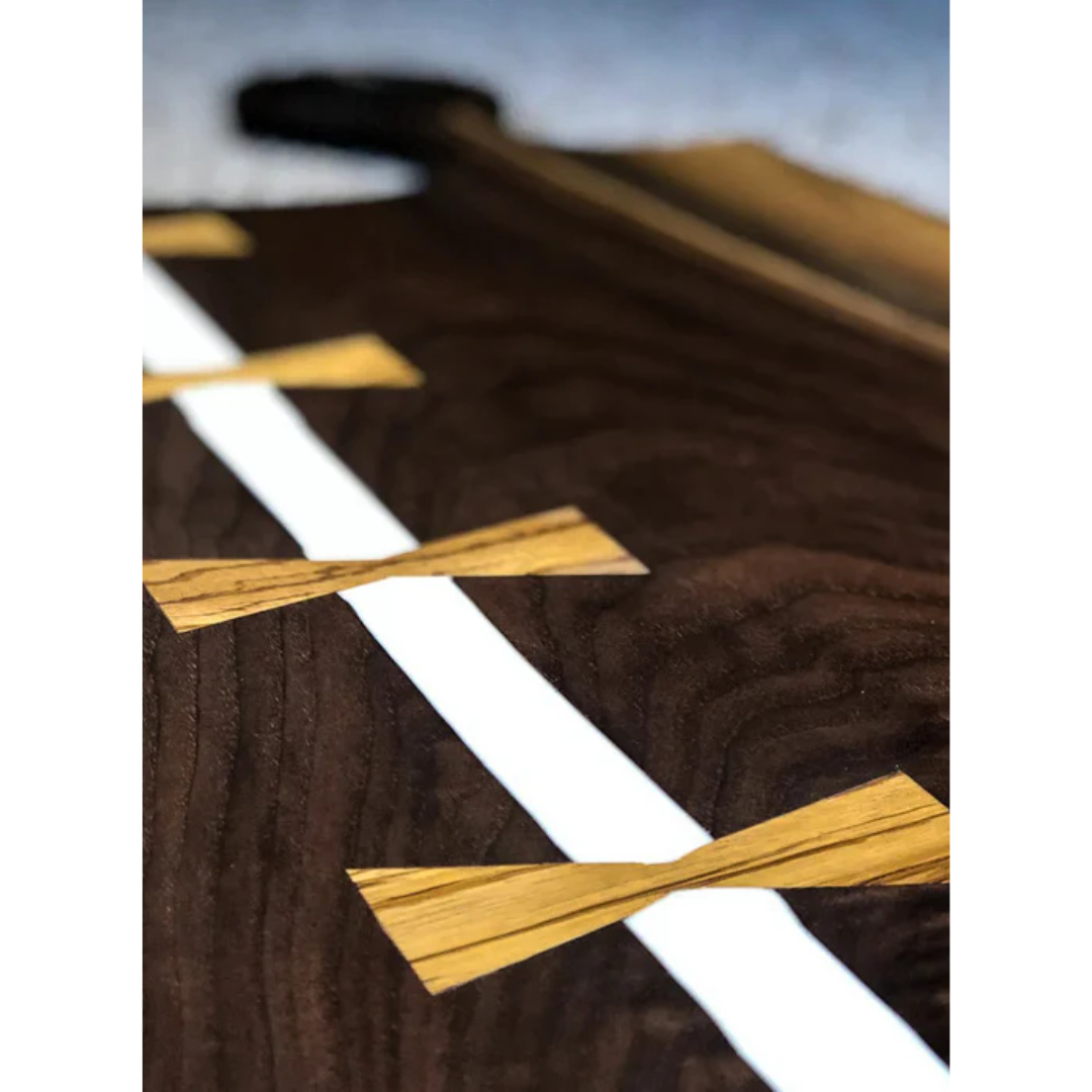 Dark wood board with white epoxy inlays created using Ecopoxy SnowWhite EPSWK20‐15L.