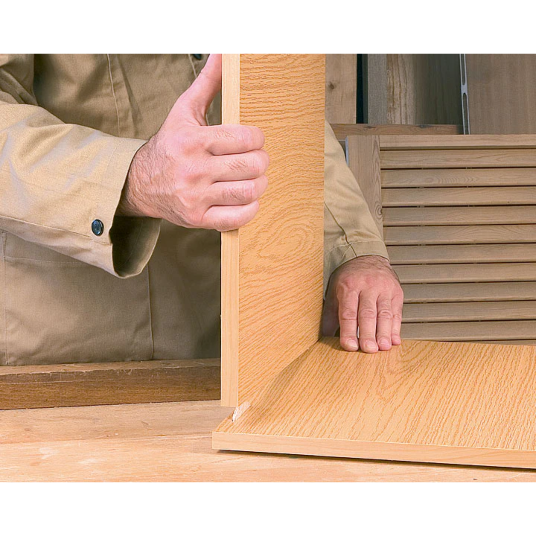 Demonstration of inserting Virutex Beechwood Biscuits into wood panel slot during furniture assembly process