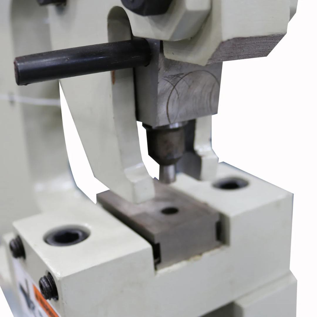 Detailed image of the Baileigh Manual Sheet Metal Punch HP-160 1004679 punch-and-die work area showcasing precision-machined tooling for clean sheet metal punching operations.