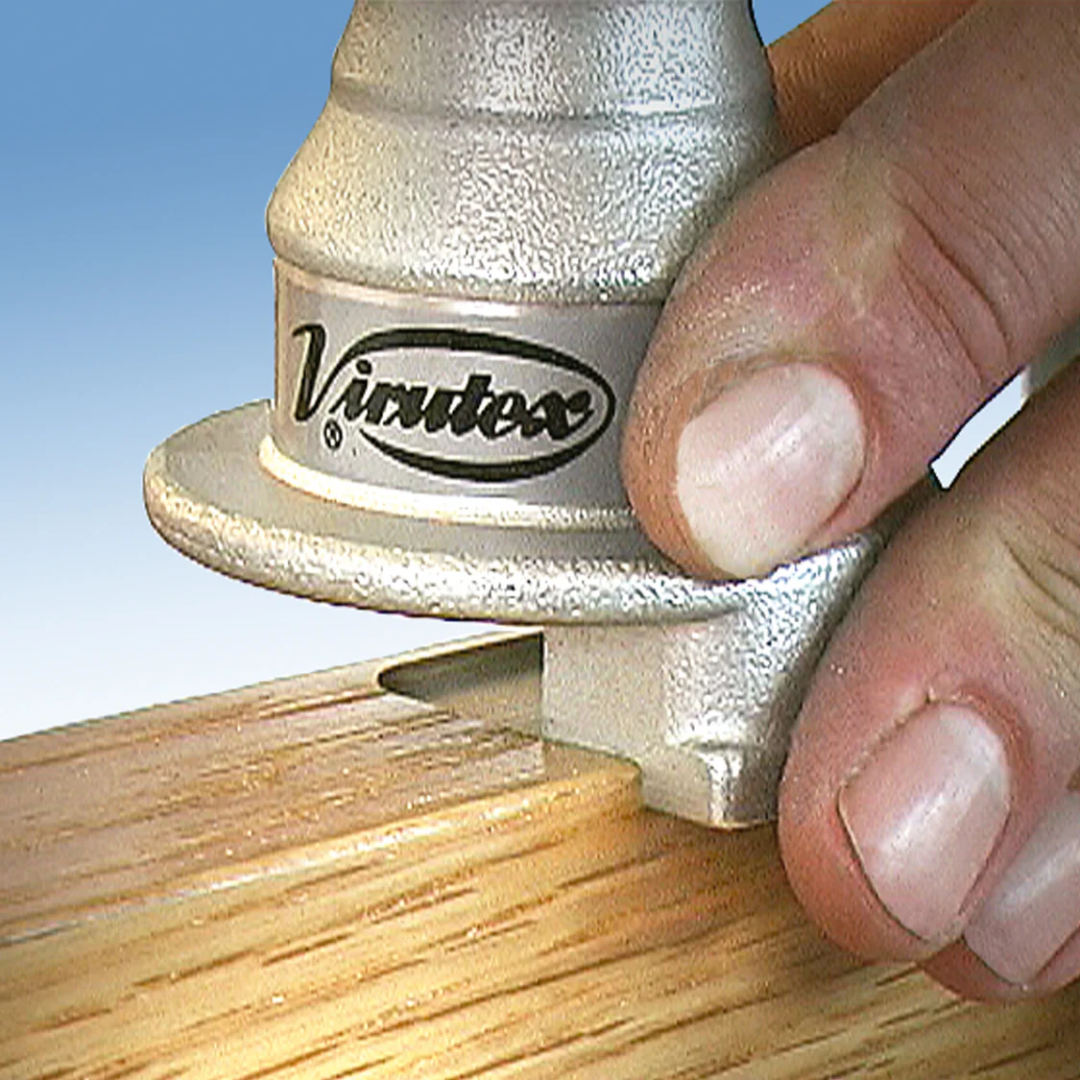 Detailed view of Virutex RC29M Square Corner Chisel For Door Mortises trimming rounded hinge recess into sharp square edges on wooden surface
