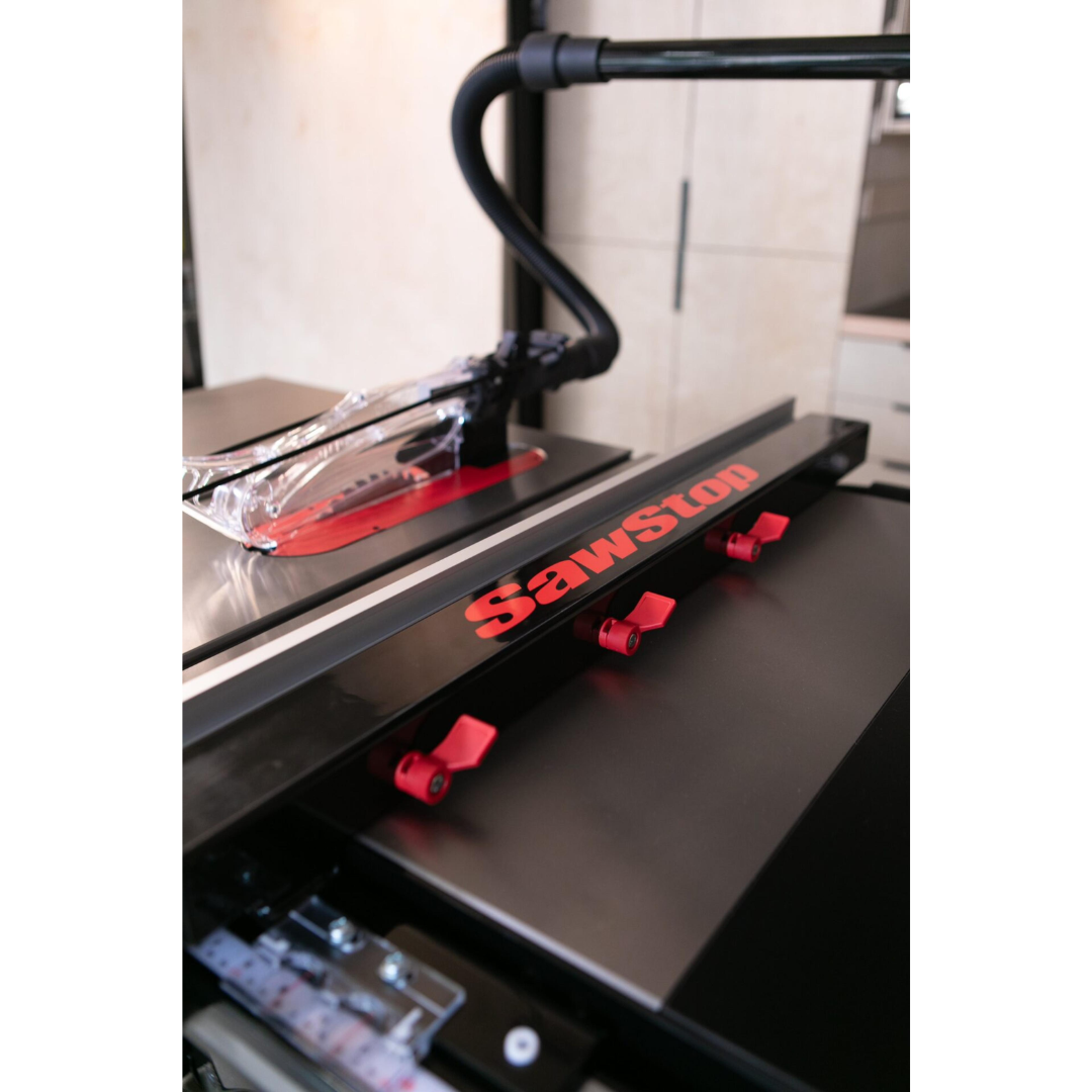 Detailed view of the SawStop T-Glide Advance Fence mounted on a table saw, featuring durable fence components and precision-engineered adjustment controls.