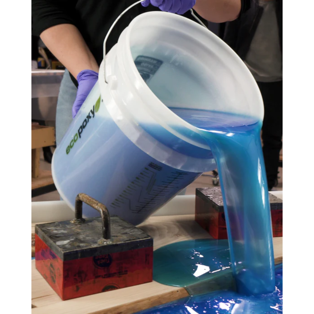 Ecopoxy EcoPoxy 19L Pour Pail White EPPRP19-WH being used to pour mixed epoxy resin smoothly into molds and surfaces.