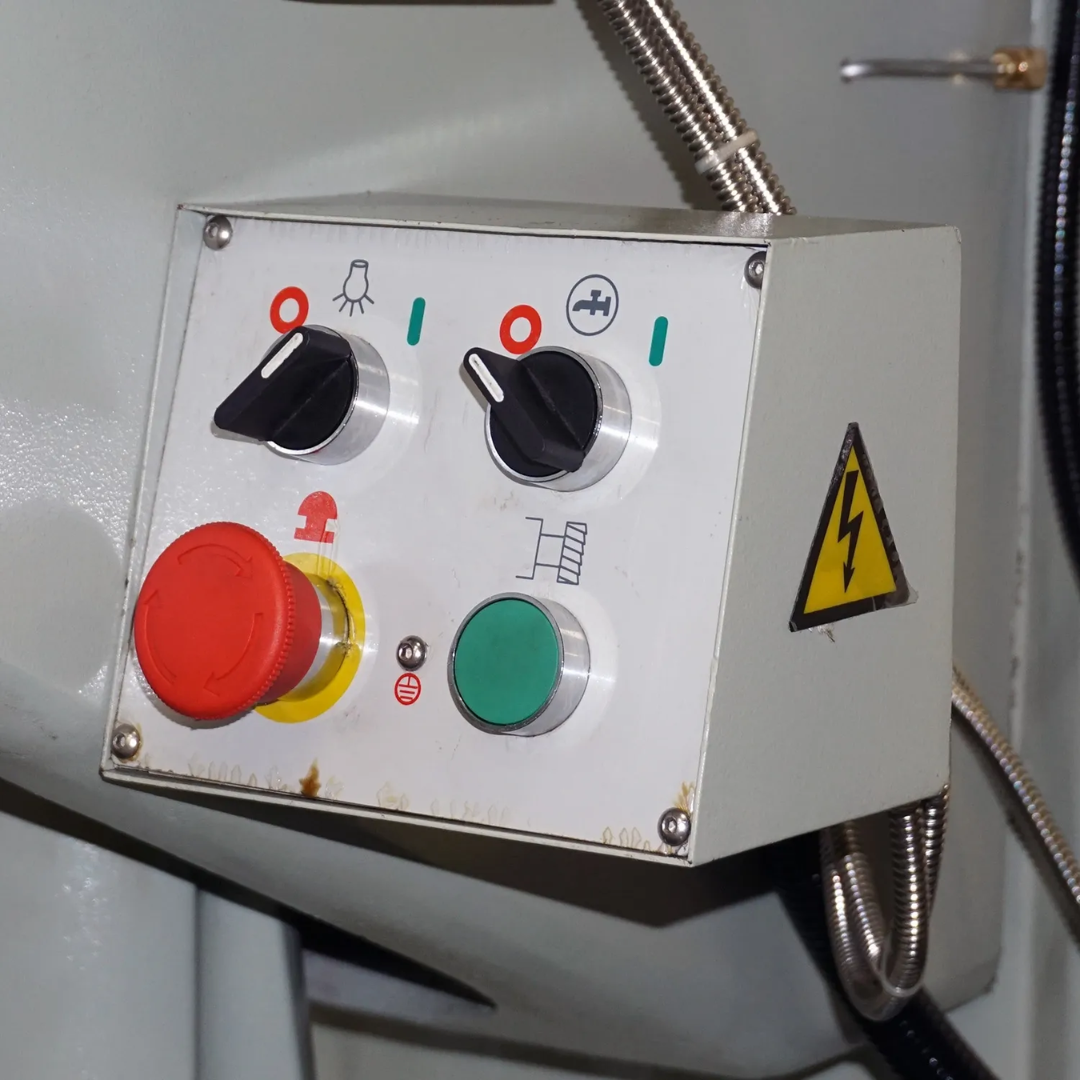 Electrical control panel of the Baileigh Vertical Mill VM-949E-VS 1019108 featuring emergency stop and machine operation controls.