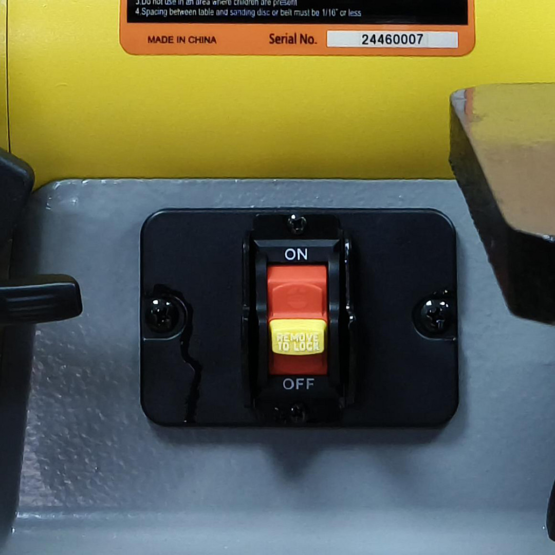 Enco 42" x 1" Vertical Combination Sanding Machine: 8" Disc Dia BD1801 close-up of the adjustable work table support and angle adjustment mechanism for precision sanding.