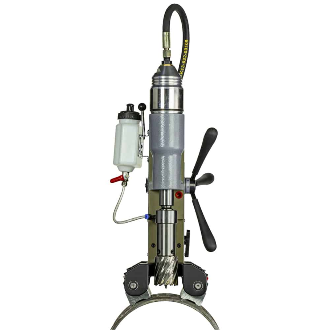 Euroboor TUBE.55/AIR Pneumatic Magnetic Drilling Machine positioned vertically on pipe surface for heavy-duty industrial pipe drilling operations