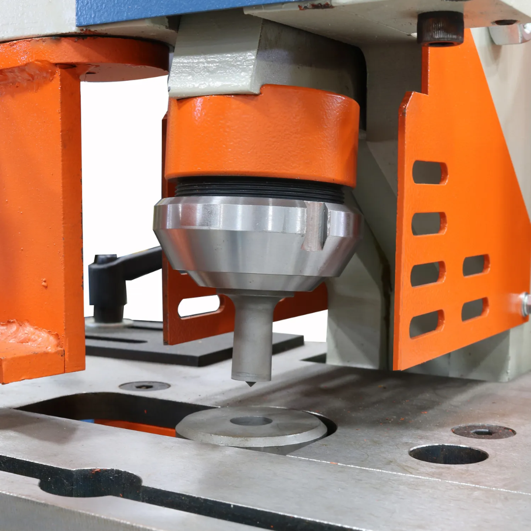 Heavy-duty hydraulic work area of the Baileigh 44-Ton 4-Station Hydraulic Ironworker, 220V 1Ph (SW-441) 1007756 designed for punching, shearing, notching, and metal fabrication applications.