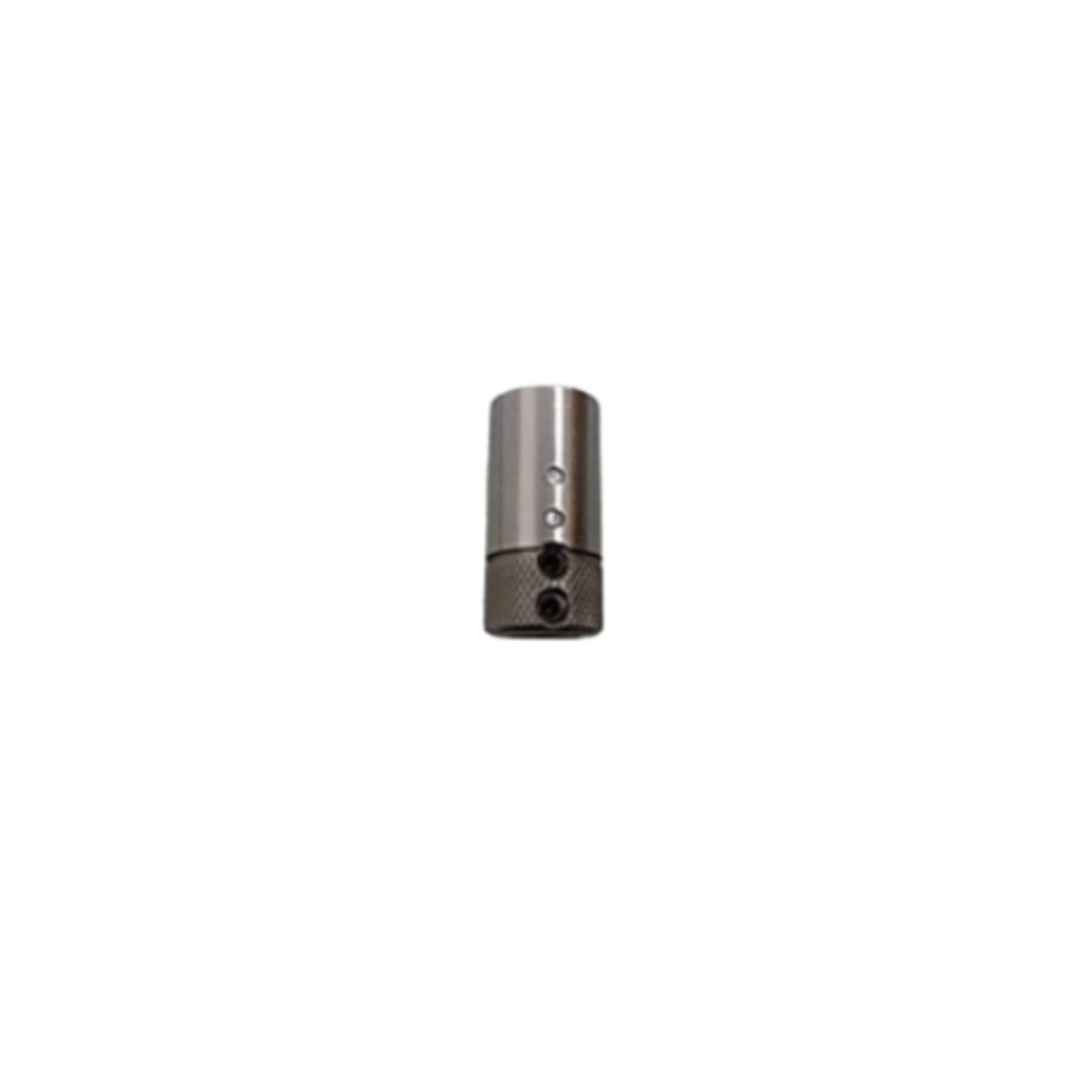 Maggi Quick Change Bit Adaptor 36000061 precision metal adaptor displayed on a cutting mat with grid background for accurate scale reference.