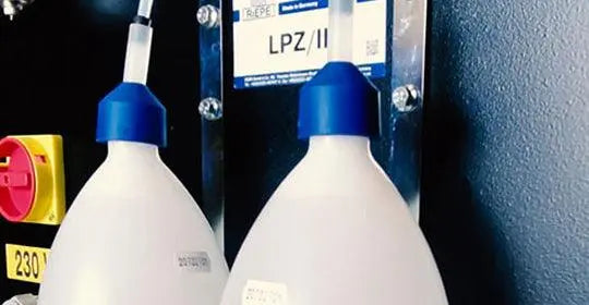 Maksiwa Edgebander CBC.TPM - Pre-Milling glue and cleaning system bottles close-up for shop consumables