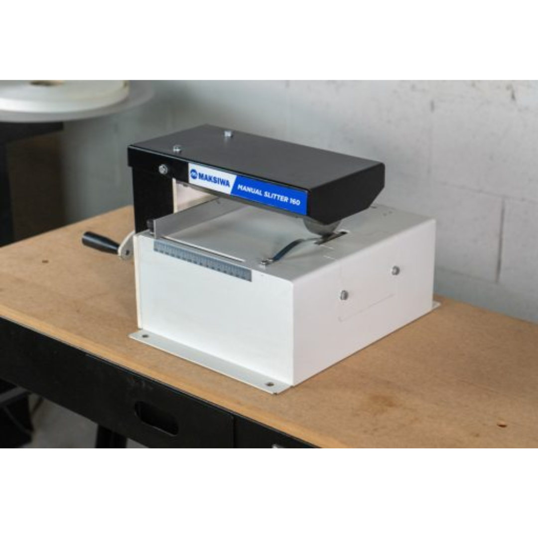 Maksiwa F.160 manual slitter rear angle showing solid base, manual feed system, and industrial slitter design