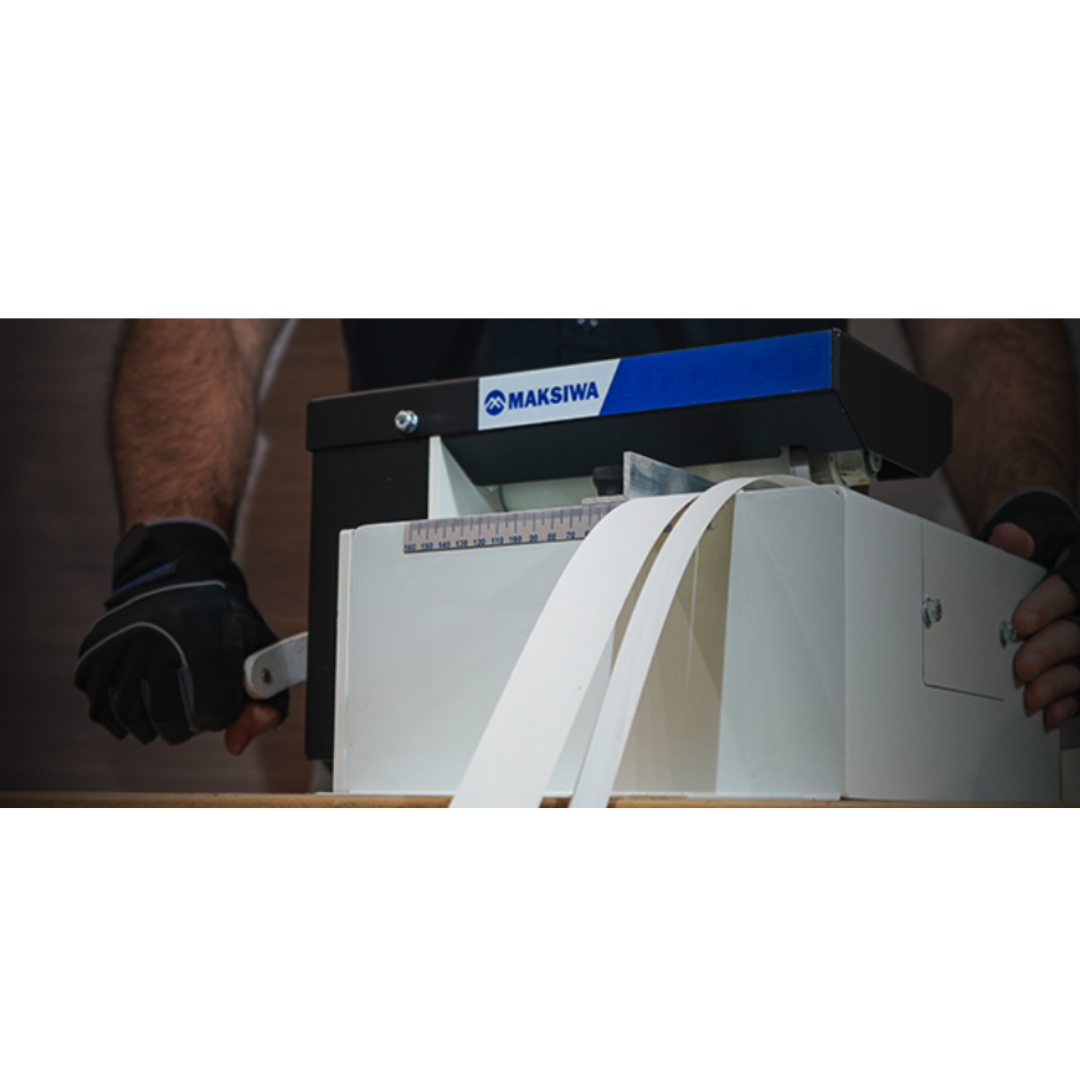 Maksiwa F.160 manual slitter showing top feed area and precision cutting blade for accurate material slitting