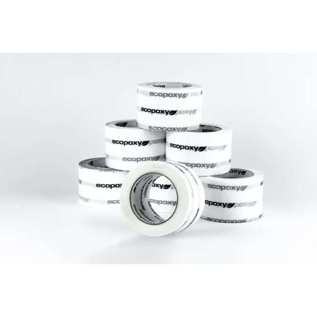Multiple rolls of Ecopoxy Epoxy Mold Release Tape EPMRT10-72X66-12PK stacked for woodworking and epoxy casting use.