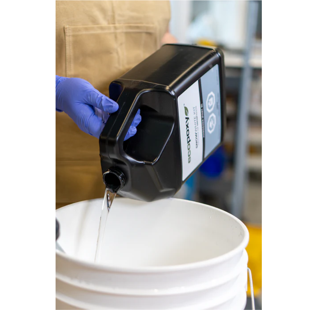 Pouring white casting resin into a mold using Ecopoxy SnowWhite EPSWK20‐15L epoxy system.
