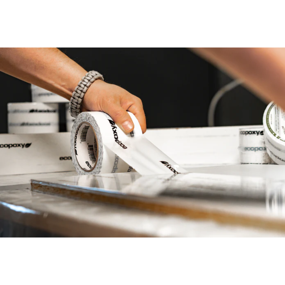 Preparing a casting mold surface using Ecopoxy Epoxy Mold Release Tape EPMRT10-72X66-12PK for epoxy projects.