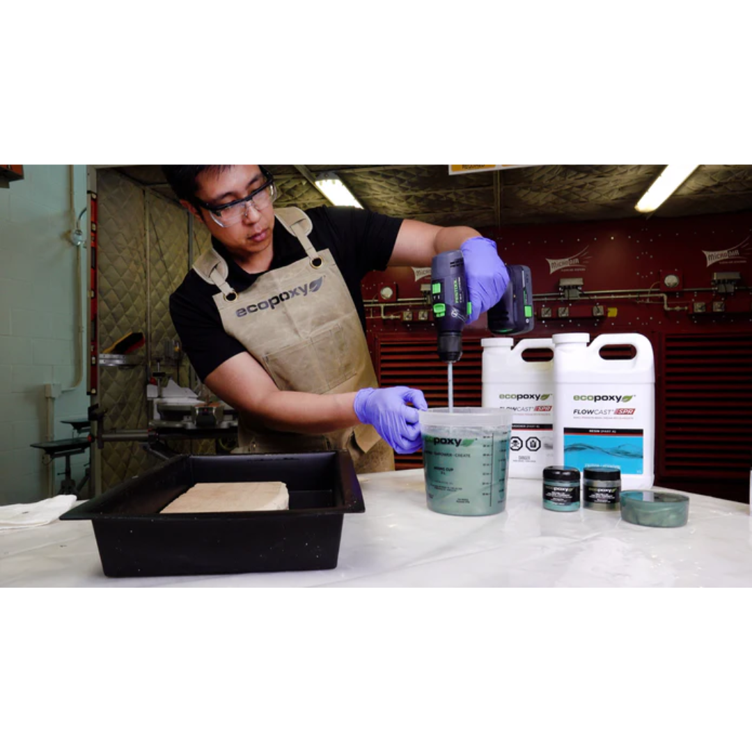 Professional workshop use of Ecopoxy Graduated Epoxy Mixing Cups for accurate epoxy resin and hardener blending.