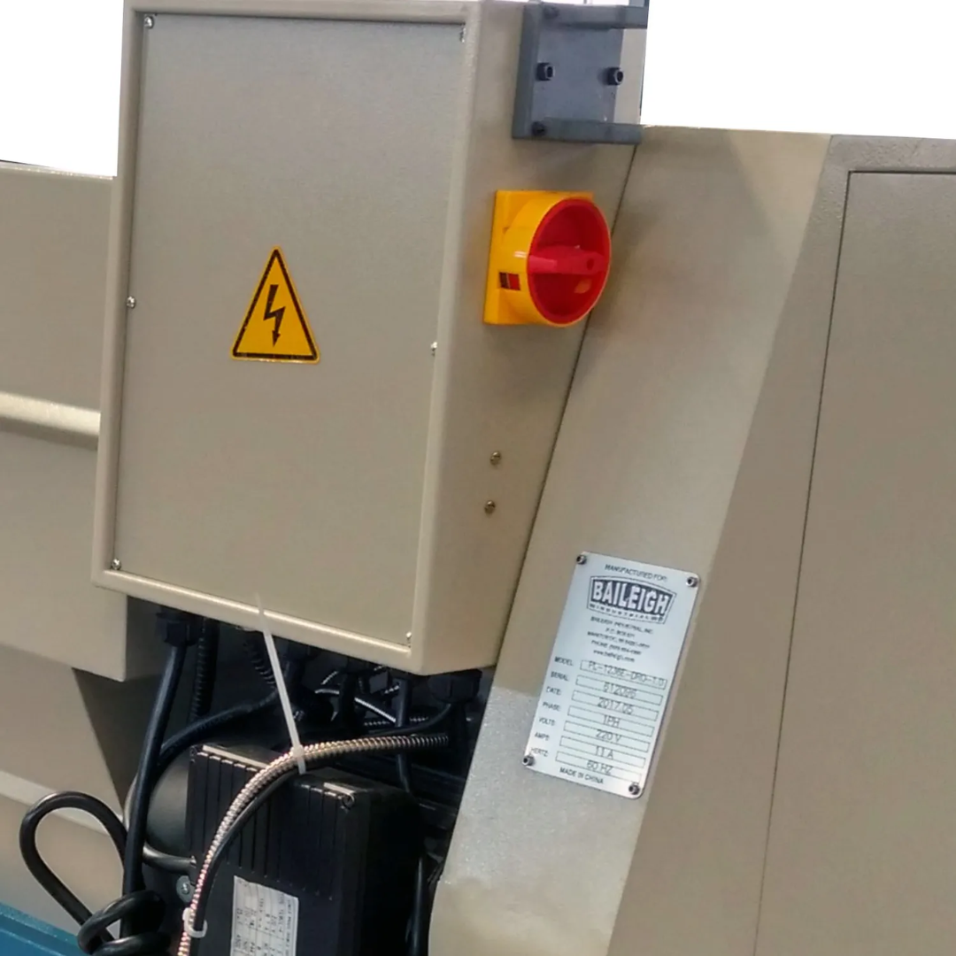 Safety control box and emergency stop system on the Baileigh 12"x36" Geared Head Metal Lathe, X/Y-Axis DRO (PL-1236E-DRO) 1016617 for enhanced operator protection.