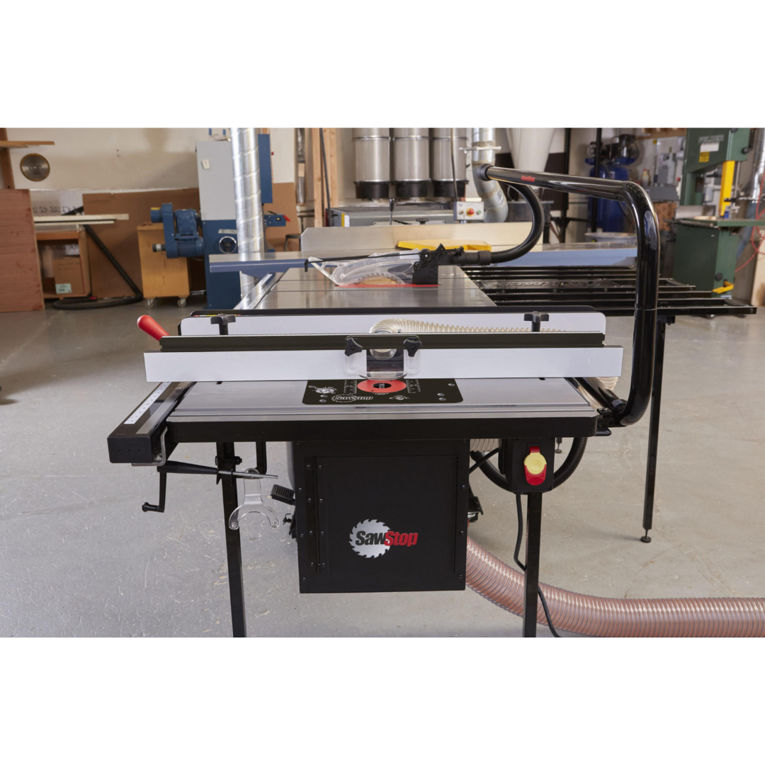 SawStop 30″ In-Line Router Table RT-TGI in active workshop use, supporting professional woodworking operations with integrated table saw compatibility.