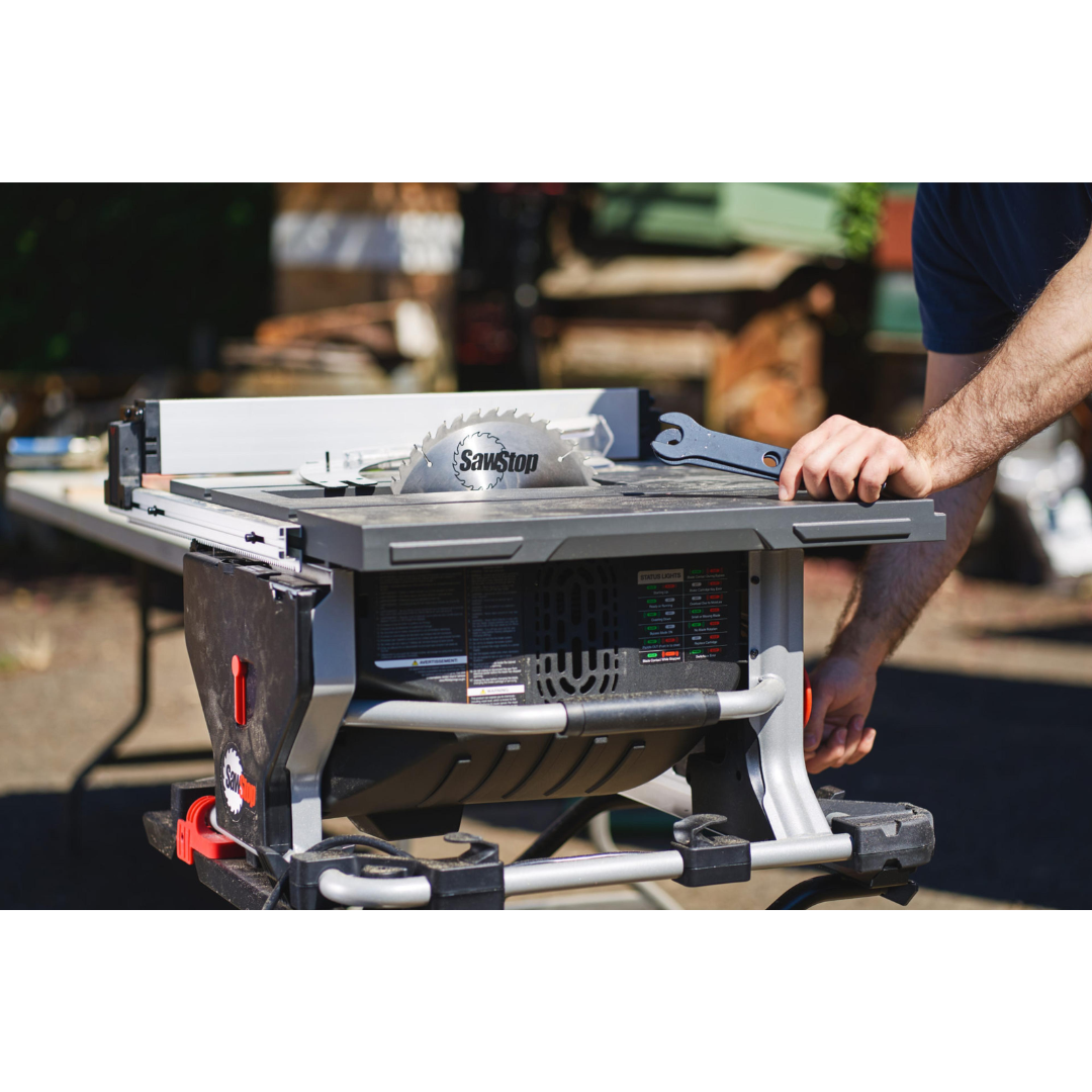 SawStop Compact Table Saw positioned in a jobsite setting, illustrating portability and reliable performance for contractors.