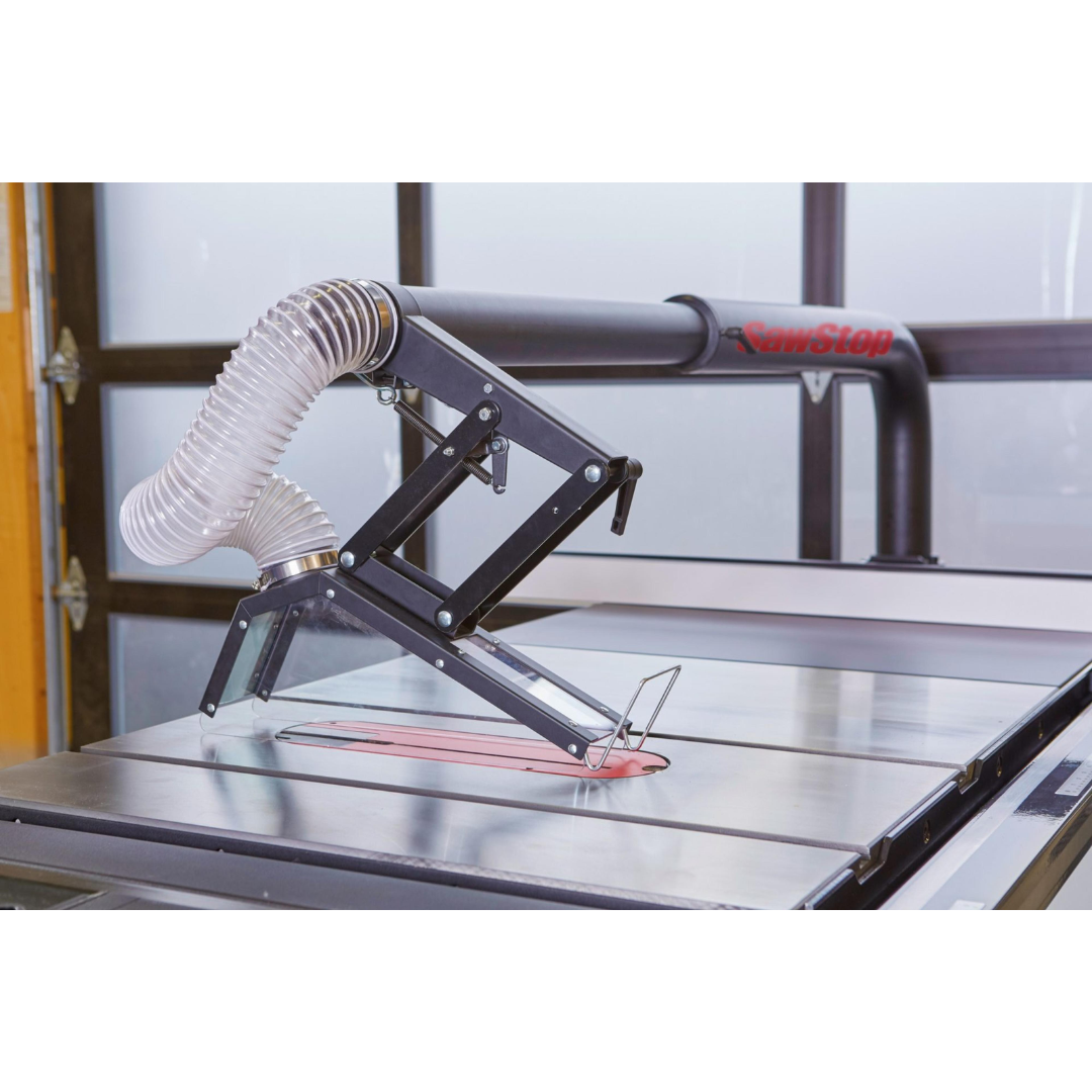 SawStop Floating Overarm Dust Collection TSG-FDC positioned over the blade area to capture airborne dust directly at the source during cutting operations.