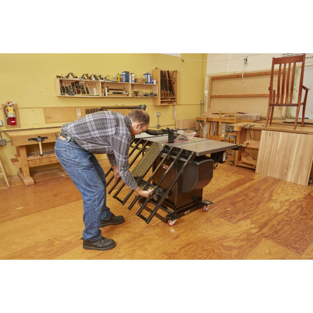 SawStop Folding Outfeed Table TSA-FOT being installed beneath a table saw, demonstrating the folding support structure and easy integration with compatible SawStop saws.