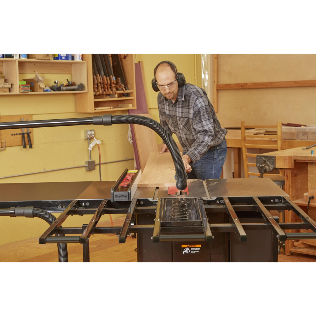 SawStop Folding Outfeed Table TSA-FOT in the raised position, illustrating the spacious support surface designed for improved material control and workflow efficiency.