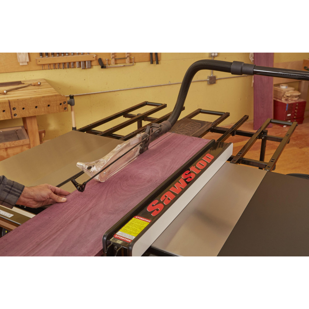 SawStop Folding Outfeed Table TSA-FOT supporting a large workpiece during cutting operations, helping maintain stability and accuracy throughout the cut.