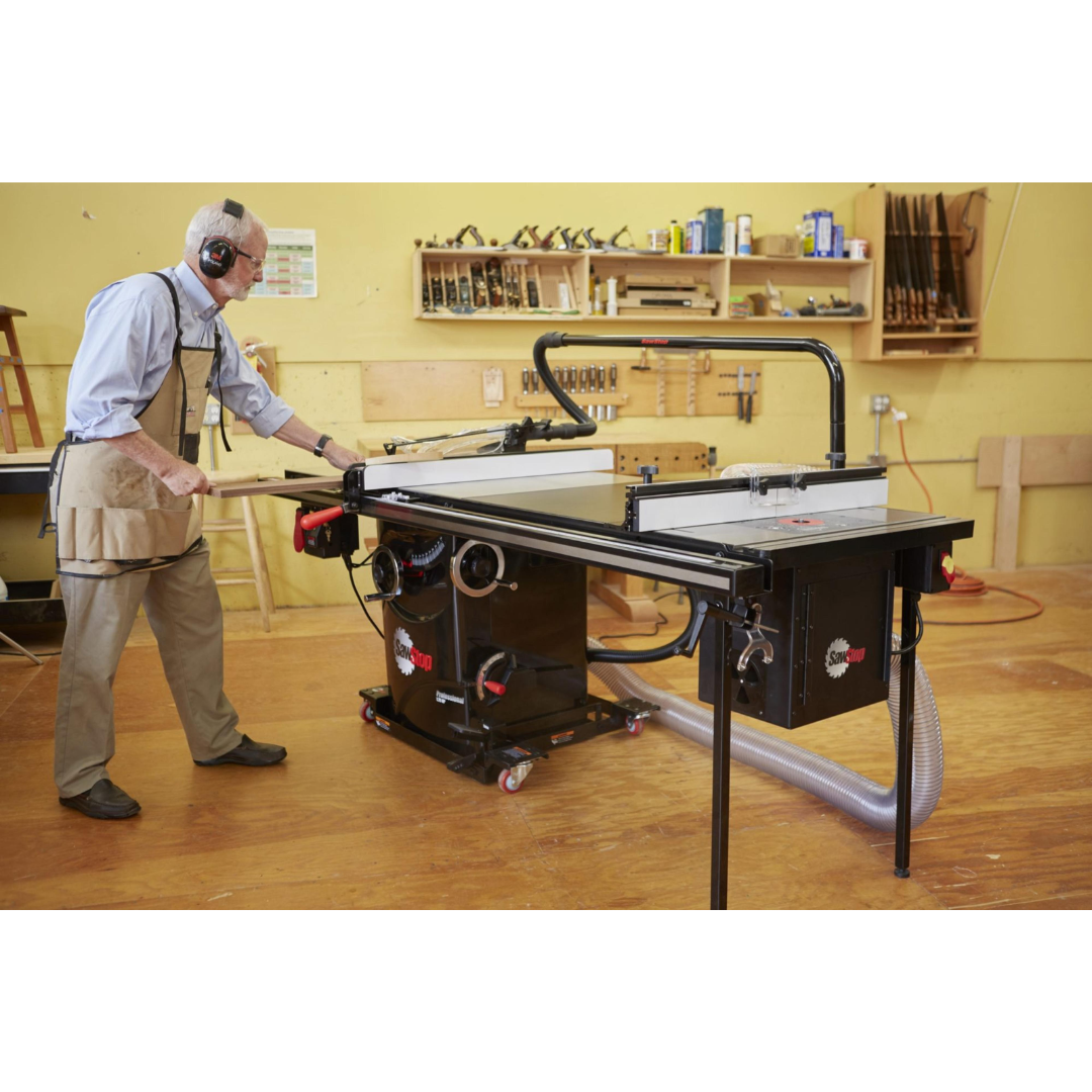SawStop Professional Cabinet Saw in a woodworking shop environment, showcasing large work surface and cabinet saw stability.