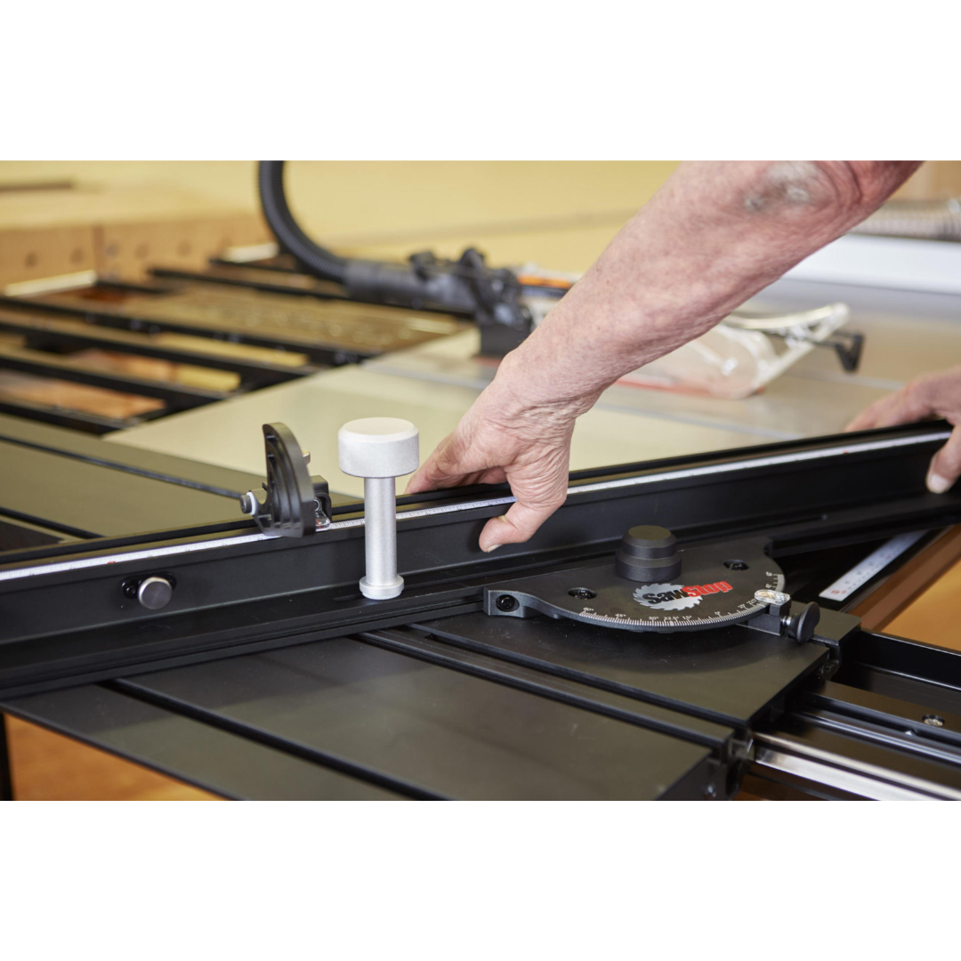 SawStop Sliding Crosscut Table TSA-SA48 in use during a crosscut operation, demonstrating smooth sliding action and precise material control.