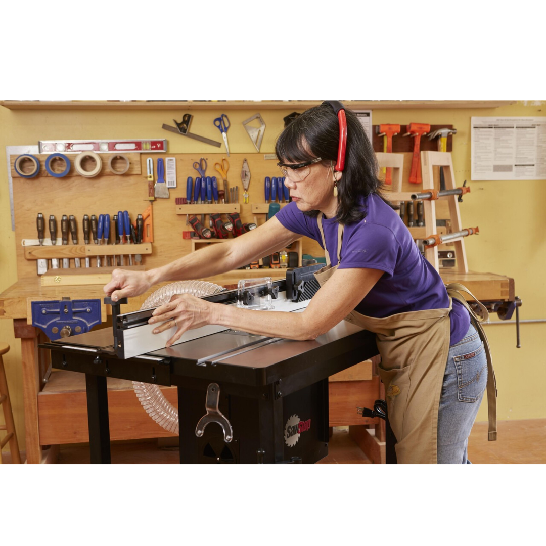 SawStop Standalone Router Table RT-FS in active woodworking use, demonstrating ergonomic operation, smooth material handling, and professional-grade routing capabilities.