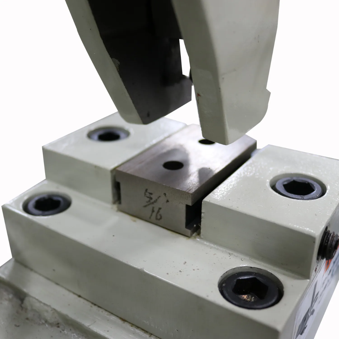Side-angle close-up of the Baileigh Manual Sheet Metal Punch HP-160 1004679 punching station demonstrating the alignment of punch tooling and workpiece support surface.