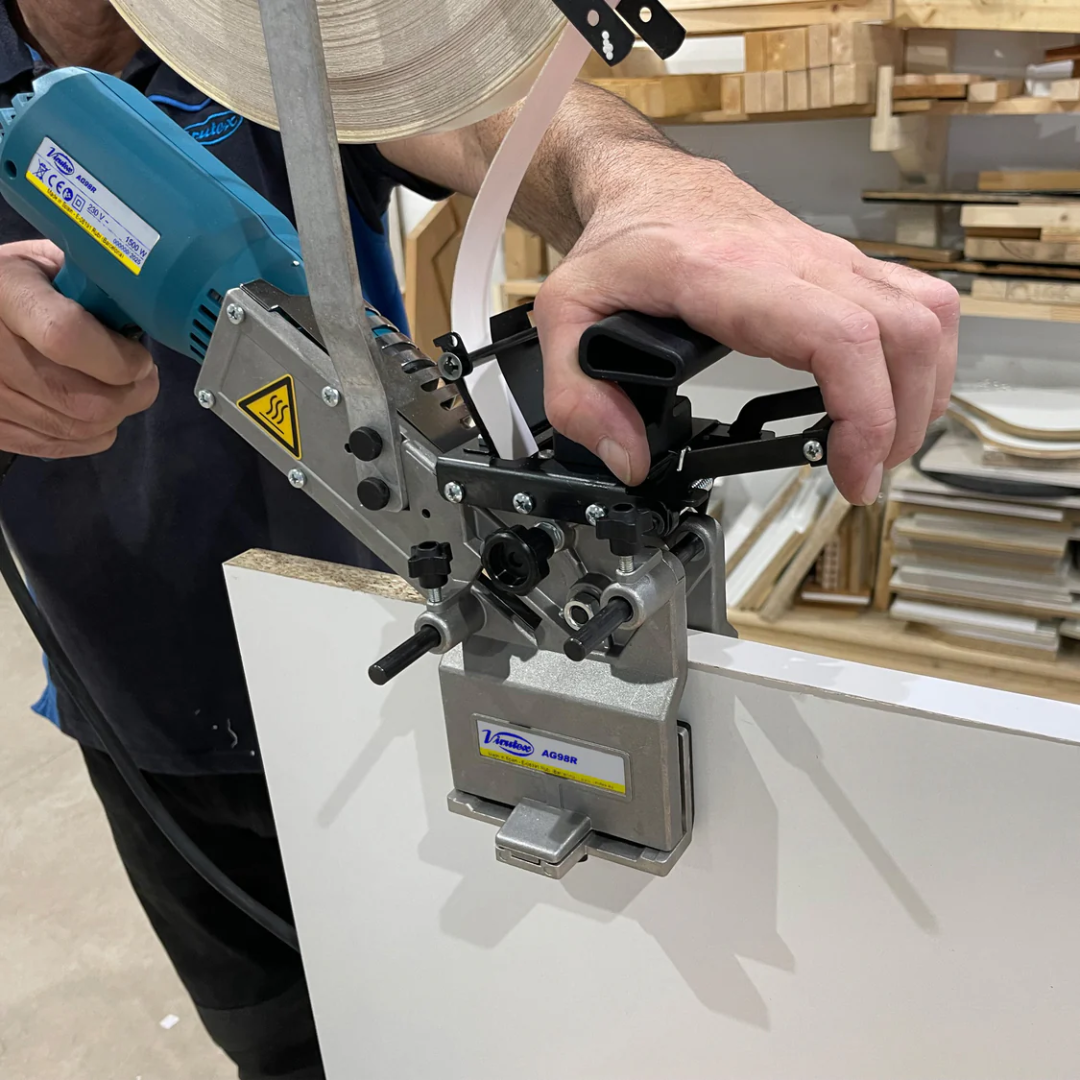 Virutex AG98R Hand-Held Hot Air Edgebander For Tapes 120V 5200499 demonstrating controlled edge banding on panel surface