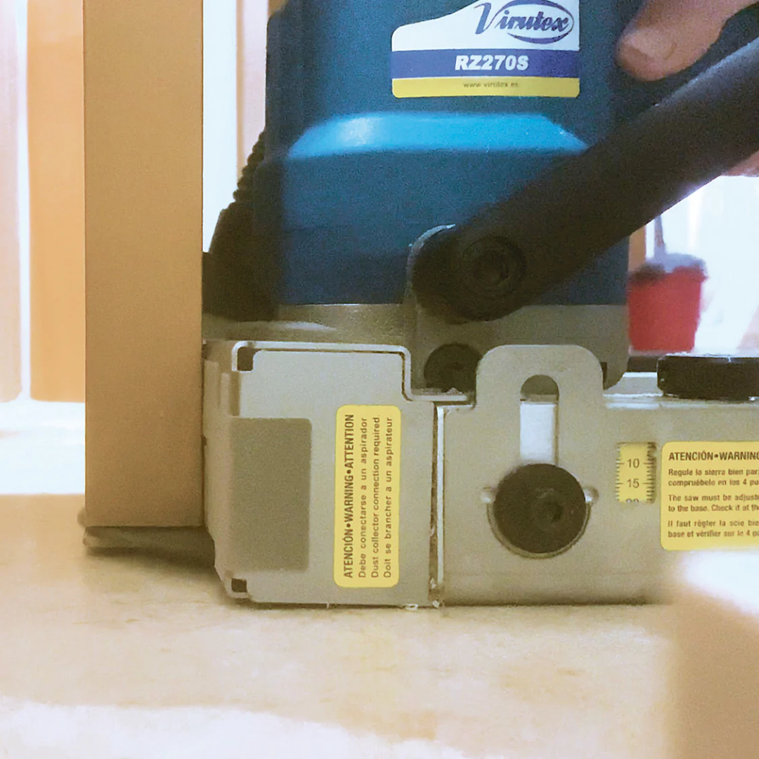 Virutex Cutting Machine For Doors RZ270S 7000399 in use cutting hinge or lock recess into wooden door with precision.