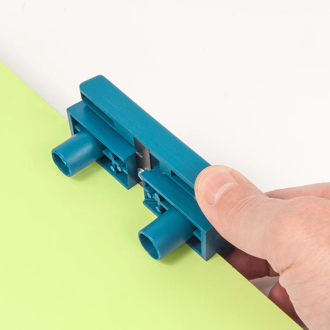 Virutex Double Edge Trimmer & Scraper AU93 2800000 positioned on wooden surface showing compact ergonomic design for workshop use.