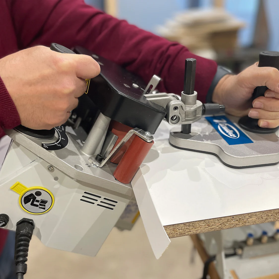 Virutex Hot Melt Portable Edgebander PEB250 Evolution (120V) 5000895 in-use view showing edge band being applied to panel with steady feed