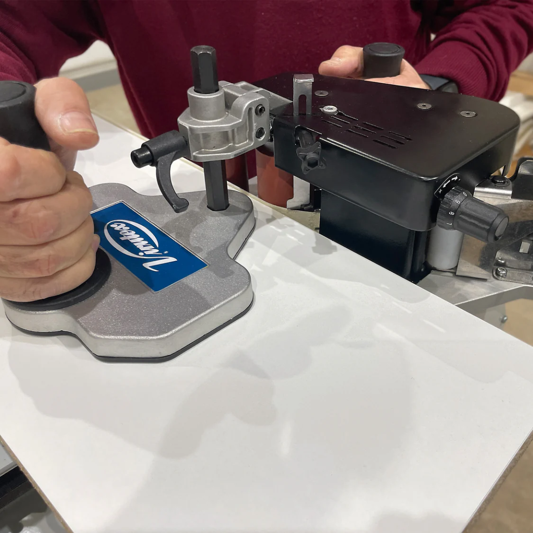 Virutex Hot Melt Portable Edgebander PEB250 Evolution (120V) 5000895 operator using machine with handheld control for precise edge application
