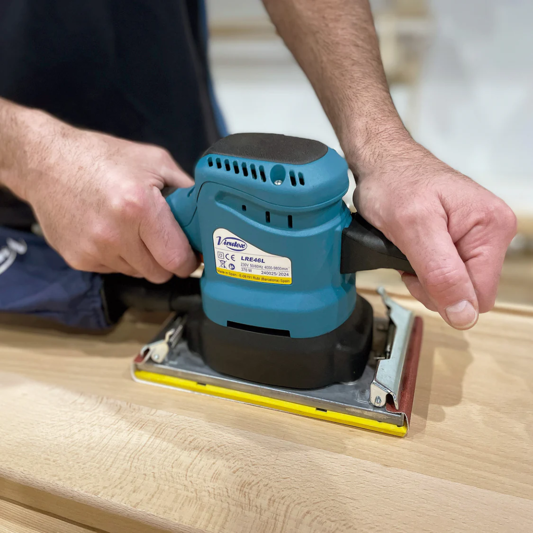Virutex LRE46L Orbital Sander (120 V) in use sanding a wooden surface for smooth finishing results