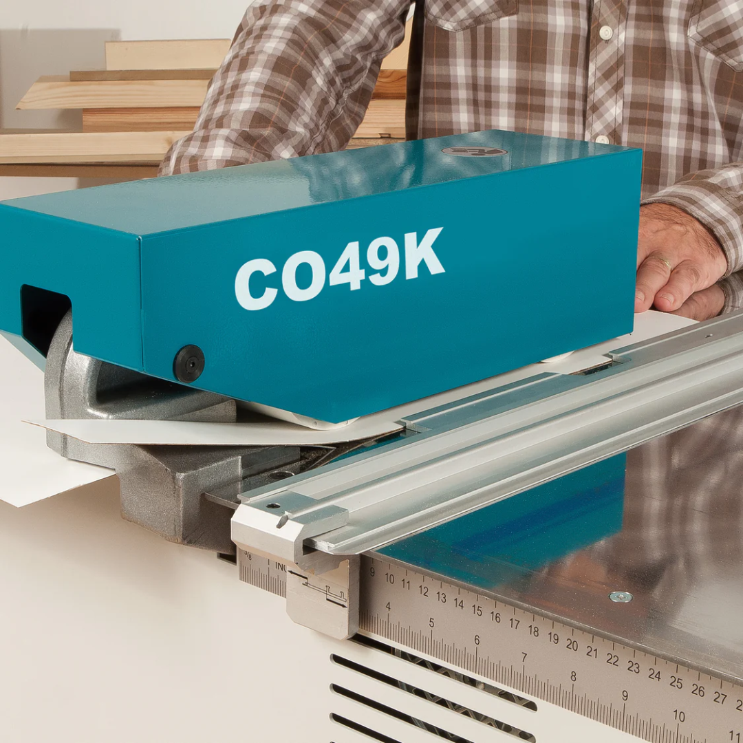 Virutex Motorized Slitter CO49K For Laminates 4900599 close-up of motor housing positioned on laminate panel during cutting operation