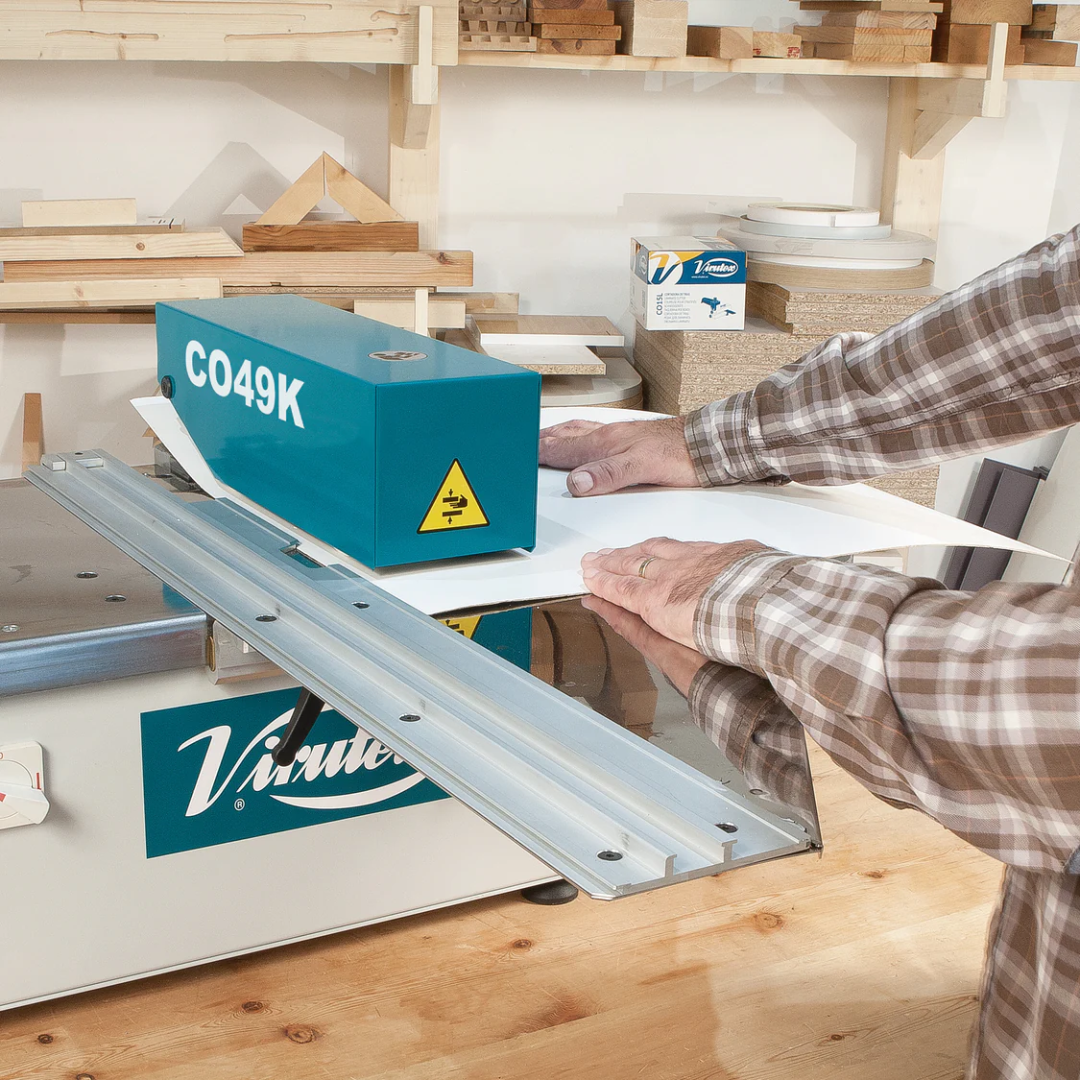 Virutex Motorized Slitter CO49K For Laminates 4900599 detail of cutting guide system and blade alignment on laminate surface