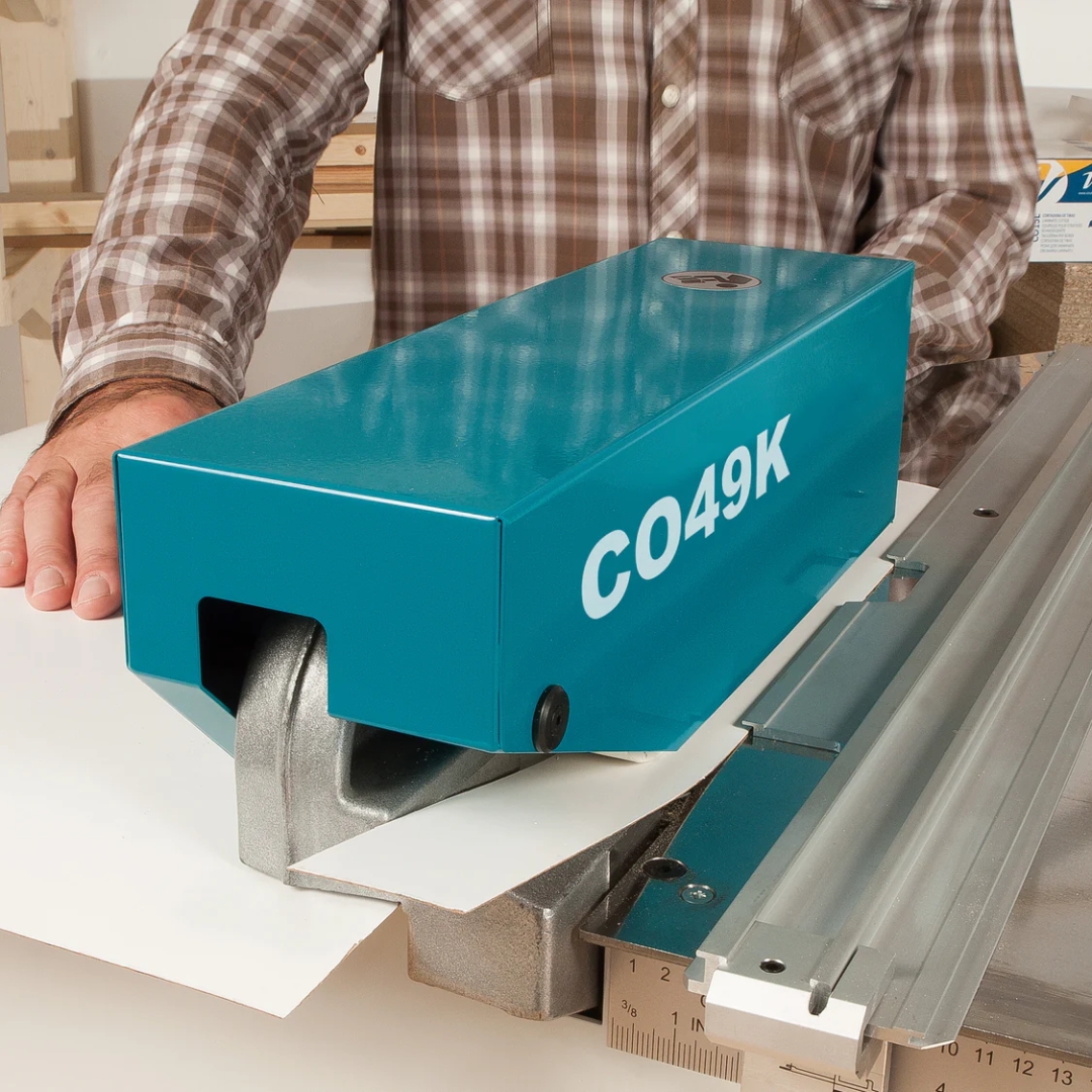 Virutex Motorized Slitter CO49K For Laminates 4900599 in-use demonstration showing operator guiding laminate sheet through precision slitting process