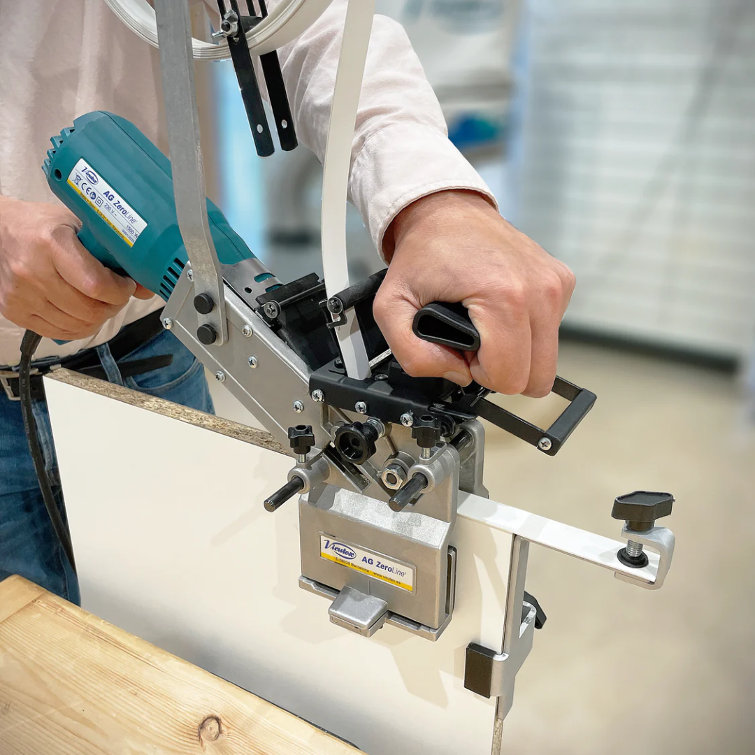 Virutex Portable Edgebander AG-Zeroline 120 V 5200699 in use applying edge banding with precision on panel surface.