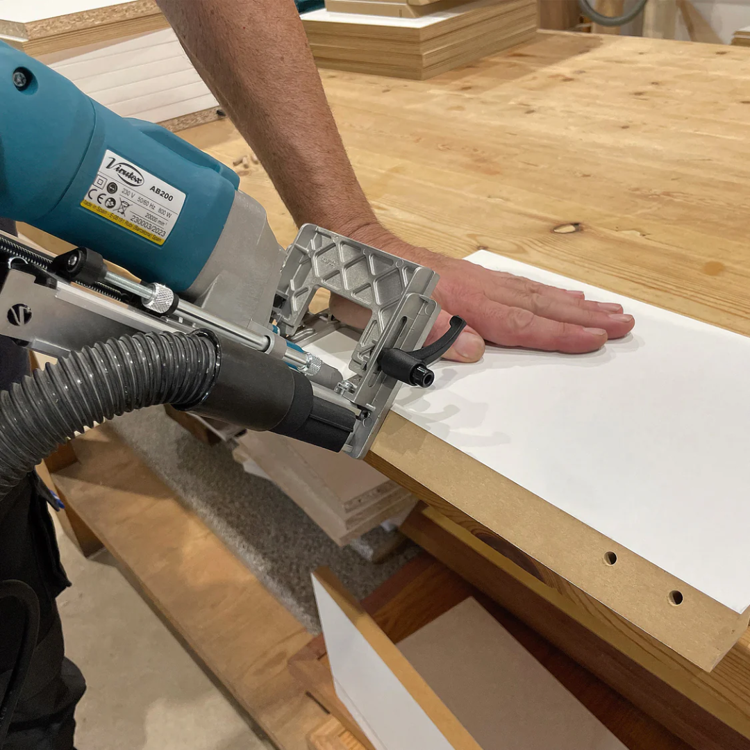 Virutex TWOO AB200 Corded Dowel Jointer (120V) 7900799 cutting clean dowel joints along edge of solid wood plank for accurate joinery applications