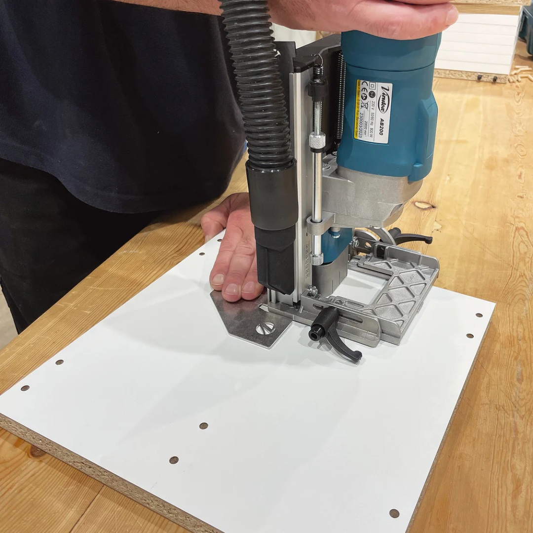 Virutex TWOO AB200 Corded Dowel Jointer (120V) 7900799 cutting dowel joints on flat panel surface using precision base plate for consistent depth control