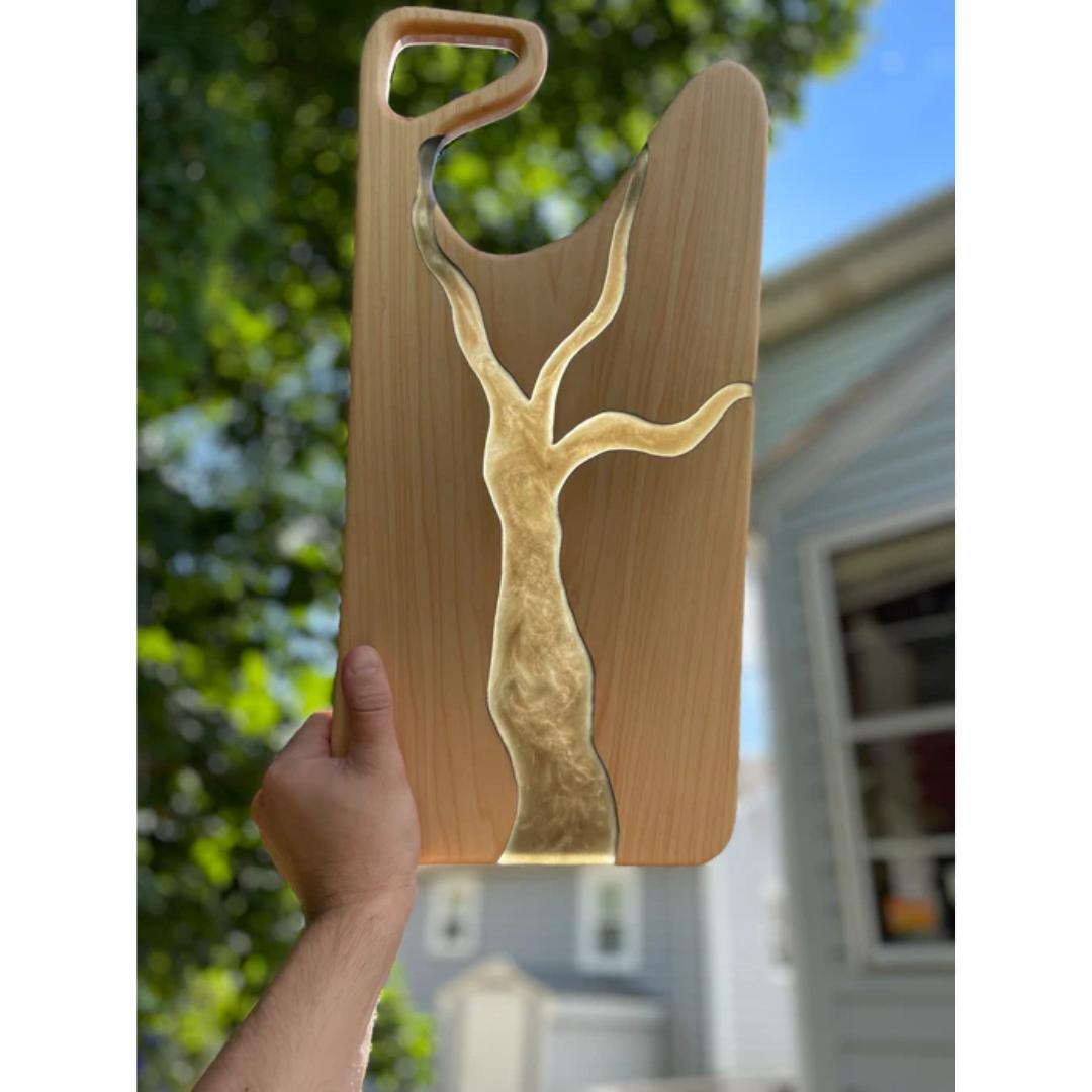 Wooden cutting board with red epoxy river made using Ecopoxy FlowCast SPR Premium Casting Epoxy.