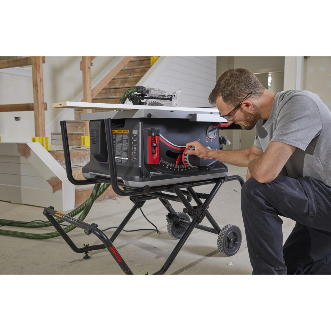 Woodworker operating the SawStop Jobsite Saw Pro in a professional workshop environment for precise and safe material processing.