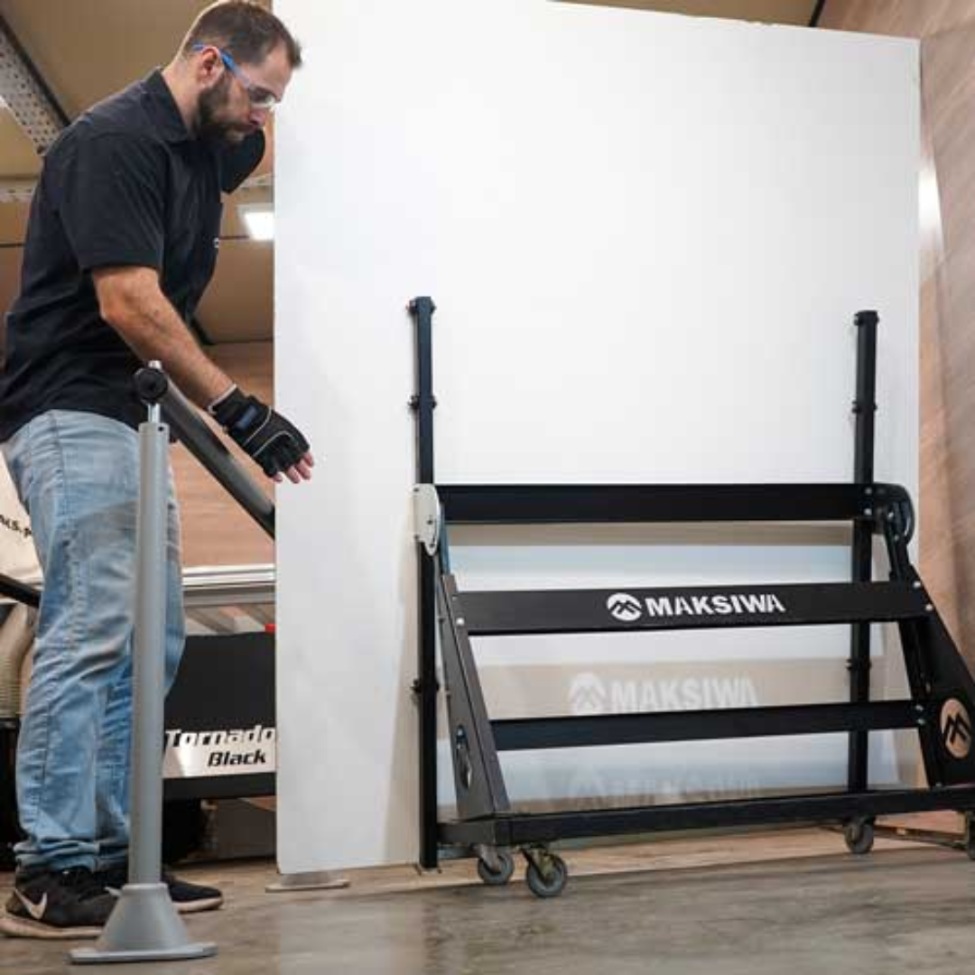 Worker loading large panels onto Maksiwa TC.3000 Panel Carrier