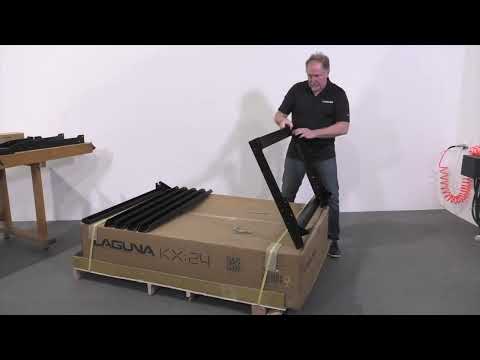 Laguna KX|24 KX2401 CNC router operator handling material on machine bed