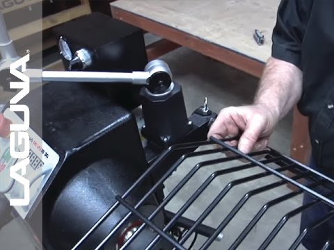 Laguna REVO 18|36 & 24|36: Flip-Away Head Stock Guard ALAREVO18 GUARD ASSEMBLY close-up showing hinged guard design for safety and easy operation