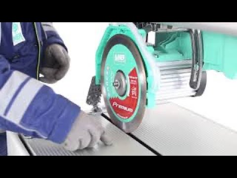 Close-up operational view of the IMER COMBICUT 250/1000 overhead rail saw blade assembly delivering accurate wet cutting performance for tile and hard surface materials