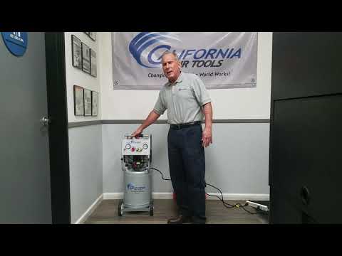 California Air Tools 10020AC Ultra Quiet 2.0 Hp 10 Gallon Air Compressor in workshop setting with operator demonstration
